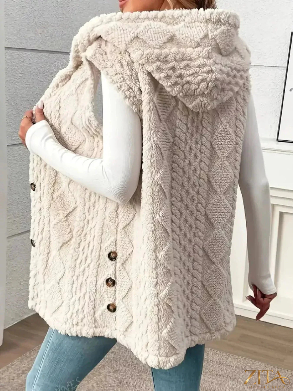 Zita La Belle Elite hooded button-up sherpa vest coat with a soft, plush exterior and front button closure.