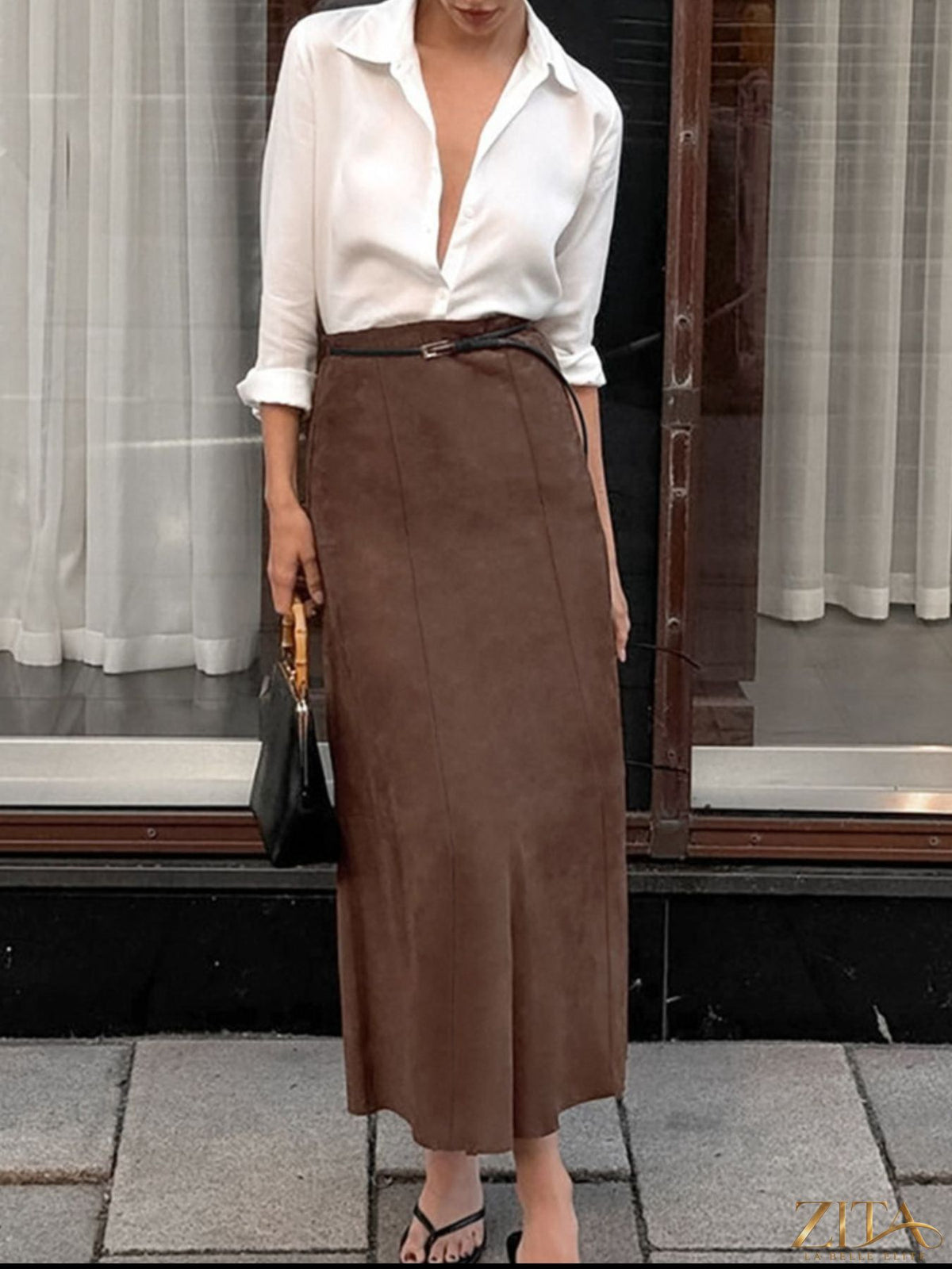 Trendsi suede midi skirt in tan with a high waist and flowing silhouette, showcased on a model.