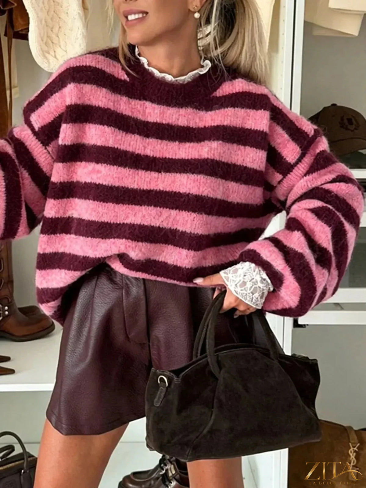 Striped dropped shoulder sweater in soft knit fabric, featuring relaxed fit and bold stripe pattern, from Trendsi.