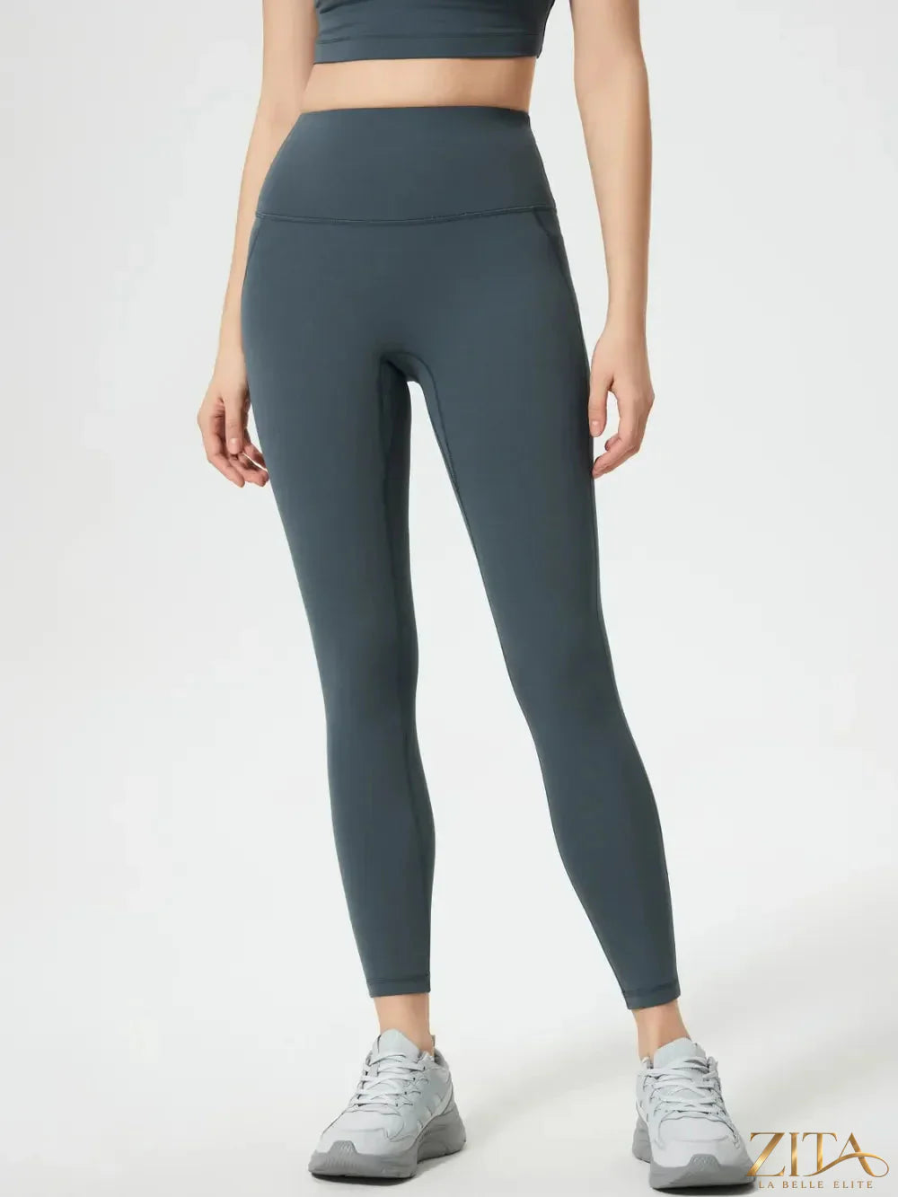 Trendsi Millennia wide waistband active leggings in black, showing their high-rise fit and stretchy fabric for workout comfort.