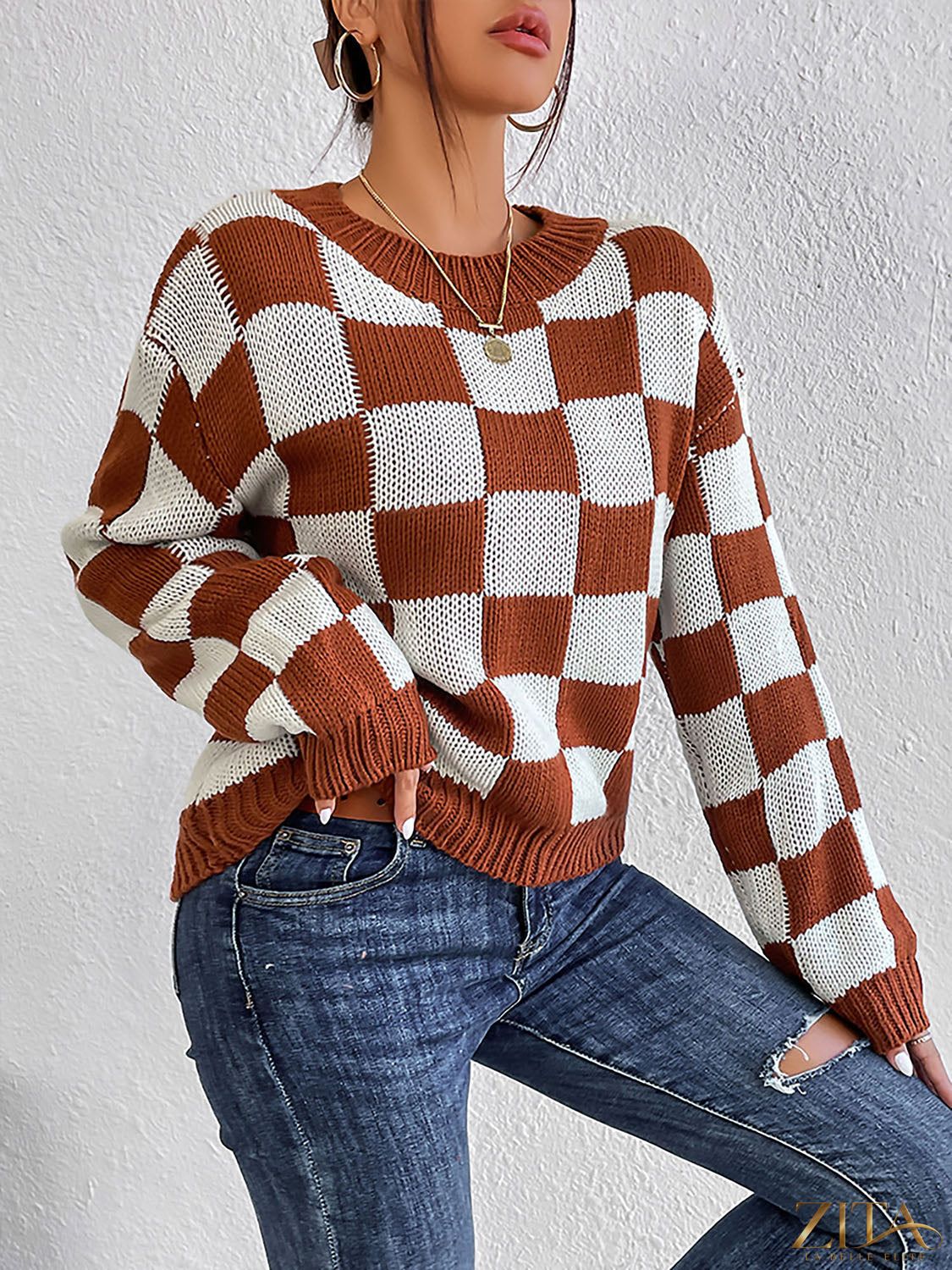Checkered round neck sweater by Trendsi with a stylish checkered pattern and ribbed collar, displayed on a mannequin.