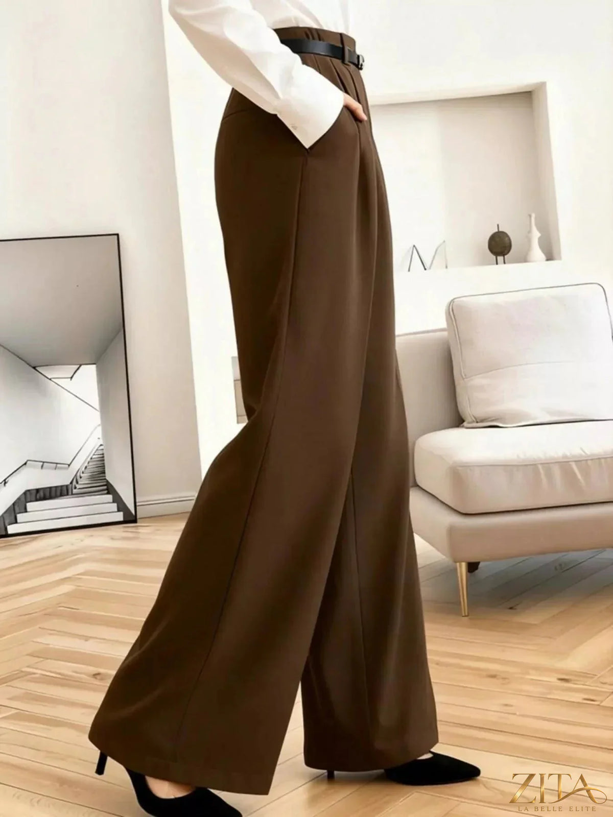 Zita La Belle Elite wide-leg pleated pants in neutral fabric, featuring a high waist and flowing silhouette.