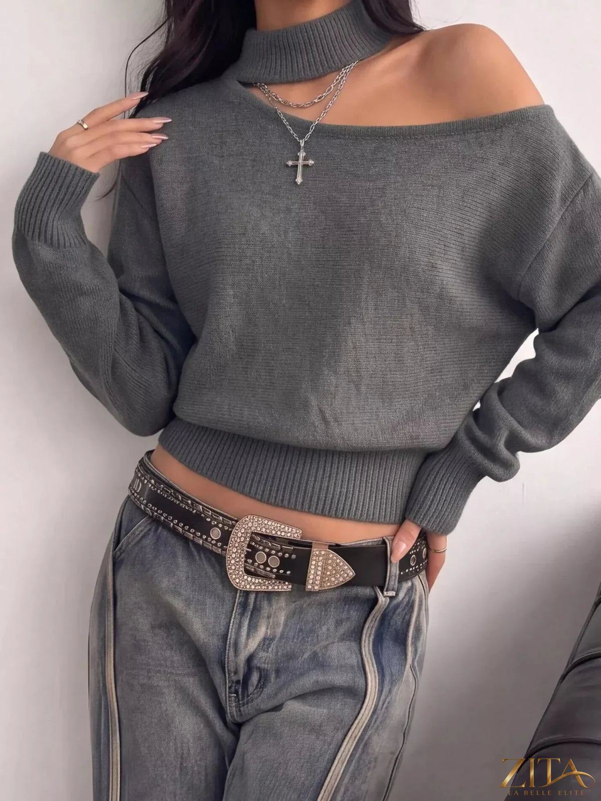 Cold-shoulder dropped shoulder sweater by Trendsi featuring a cozy knit fabric and stylish cut-out shoulders.