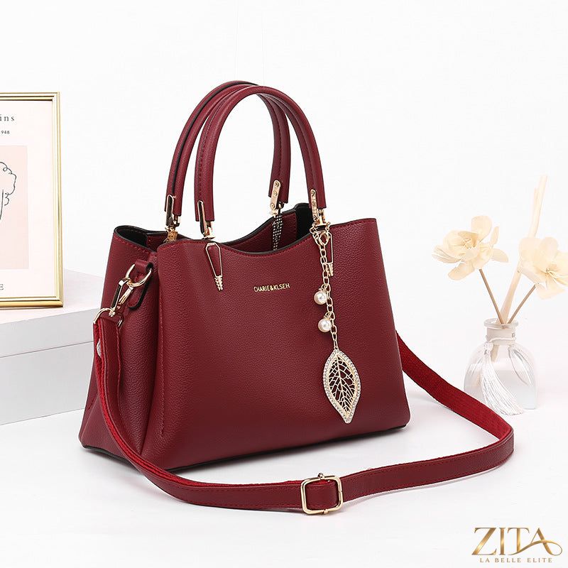 Zita La Belle Elite top-handle leather handbag with gold hardware, showcasing its structured design and smooth leather finish.