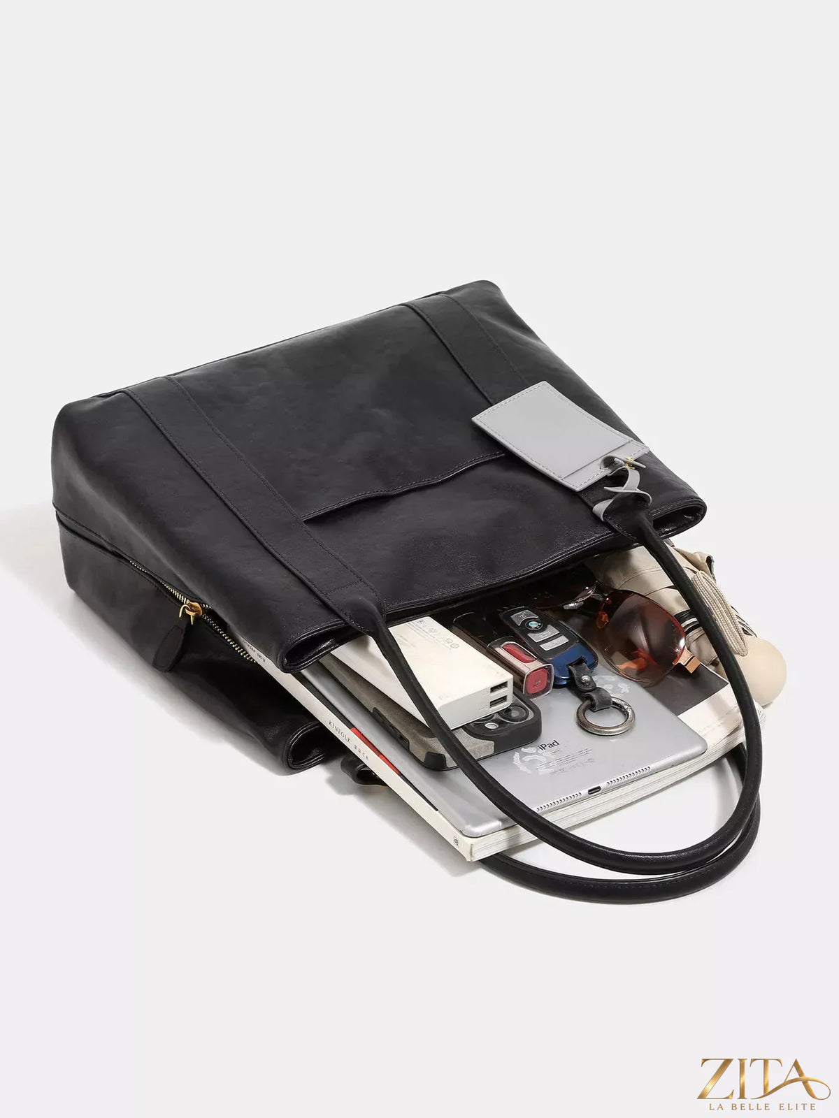 Trendsi PU leather tote bag with dual top handles and spacious interior, showcasing a sleek, modern design.