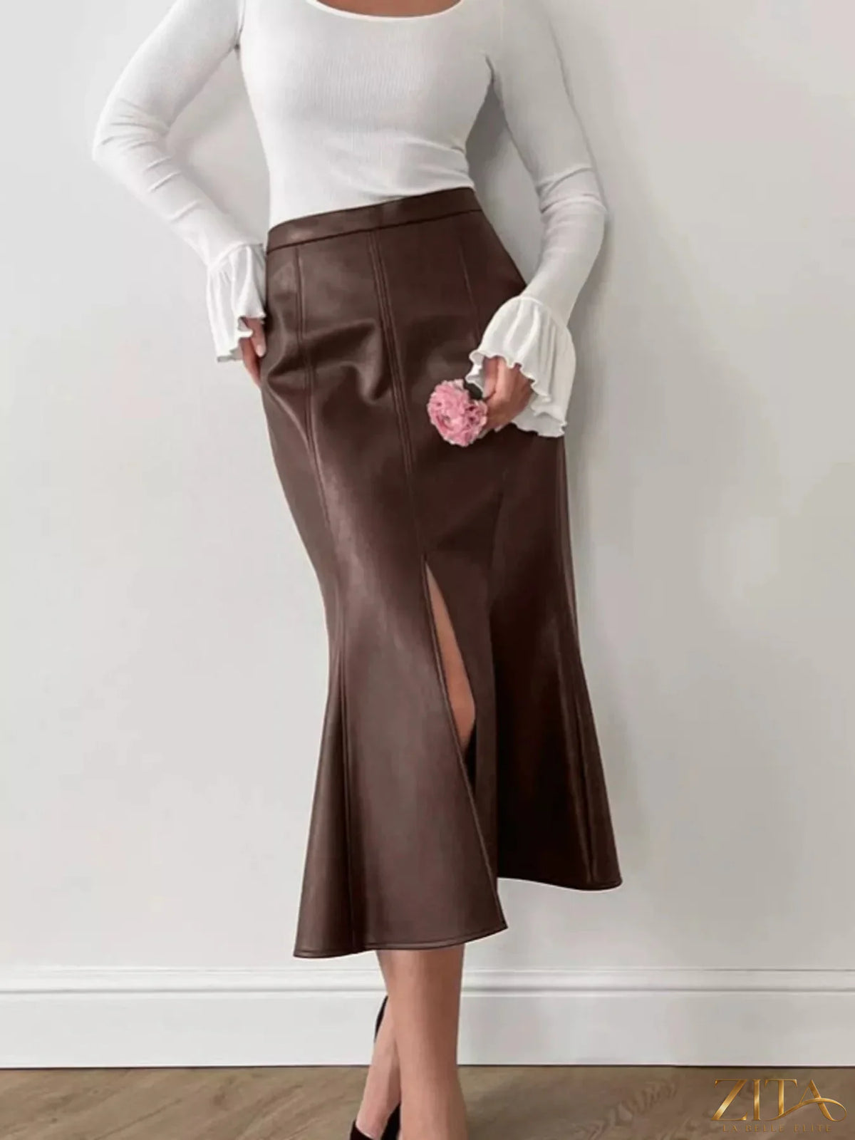 Zita La Belle Elite slit mermaid midi skirt with fitted silhouette and flowing hem, stylishly displayed on a model.