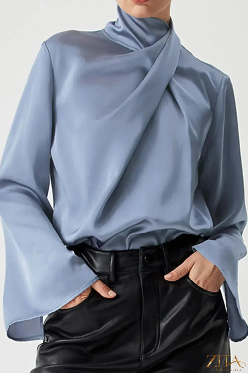 Zita La Belle Elite cutout turtleneck long sleeve blouse featuring a stylish design and fitted silhouette in black fabric.