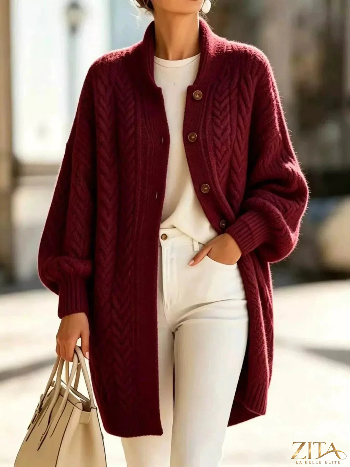 Plus size Zita La Belle Elite cable-knit button-down cardigan in full size, featuring a cozy, textured knit pattern and front buttons.