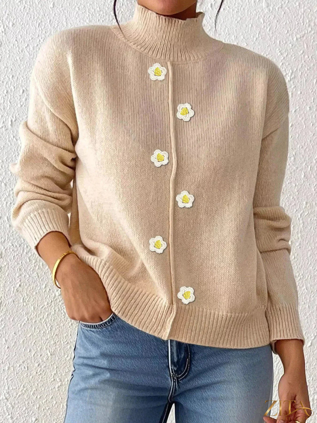 Zita La Belle Elite floral applique turtleneck sweater in cream with colorful floral embroidery, cozy knit fabric, and high neckline.