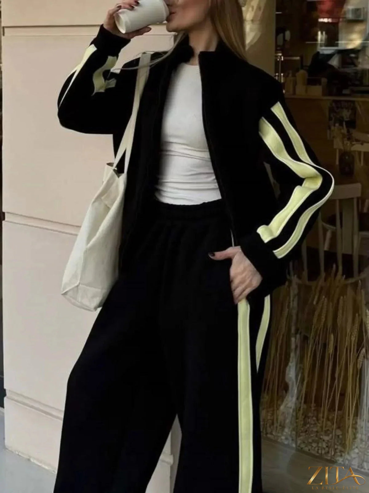 Zita La Belle Elite contrast striped zip-up top and pants set, showing the stylish matching casual outfit with bold stripes.