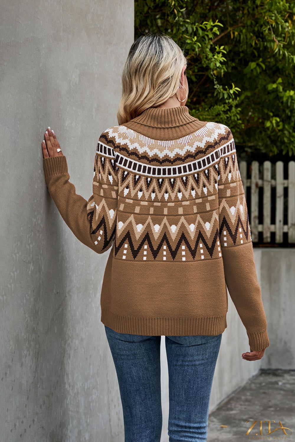 Ribbed trim turtleneck sweater by Trendsi, featuring a cozy fit and classic design in a neutral color, shown on a model.