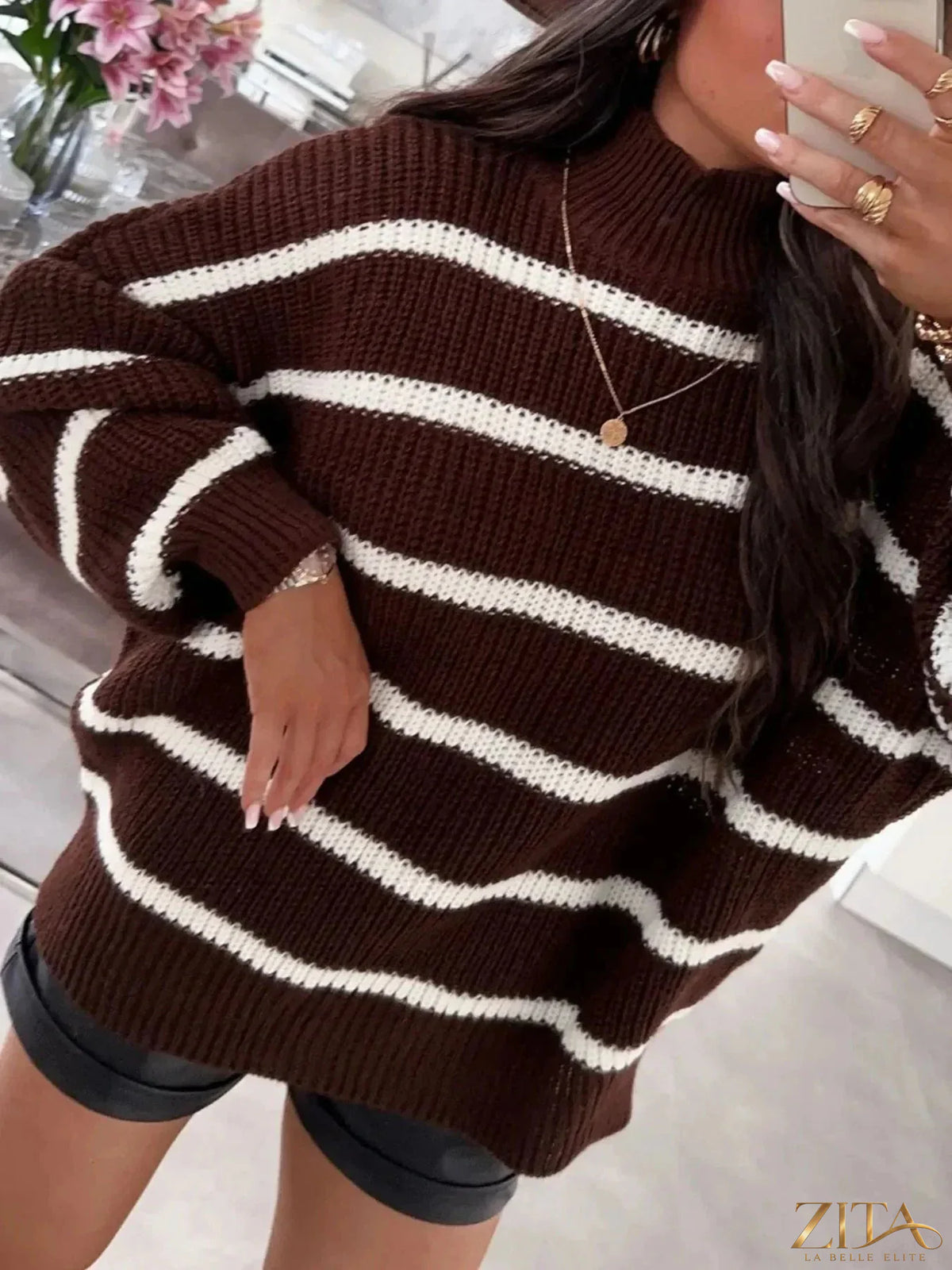 Striped turtleneck long sleeve sweater by Trendsi, featuring a cozy fit with bold horizontal stripe pattern in various colors.