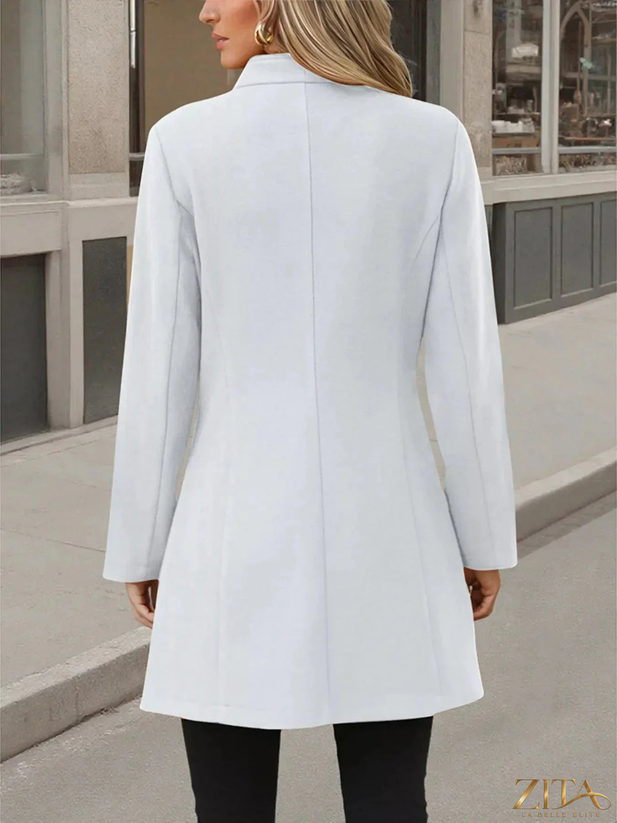Zita La Belle Elite button-up long sleeve coat in a stylish, tailored design, shown hanging on a wooden hanger.