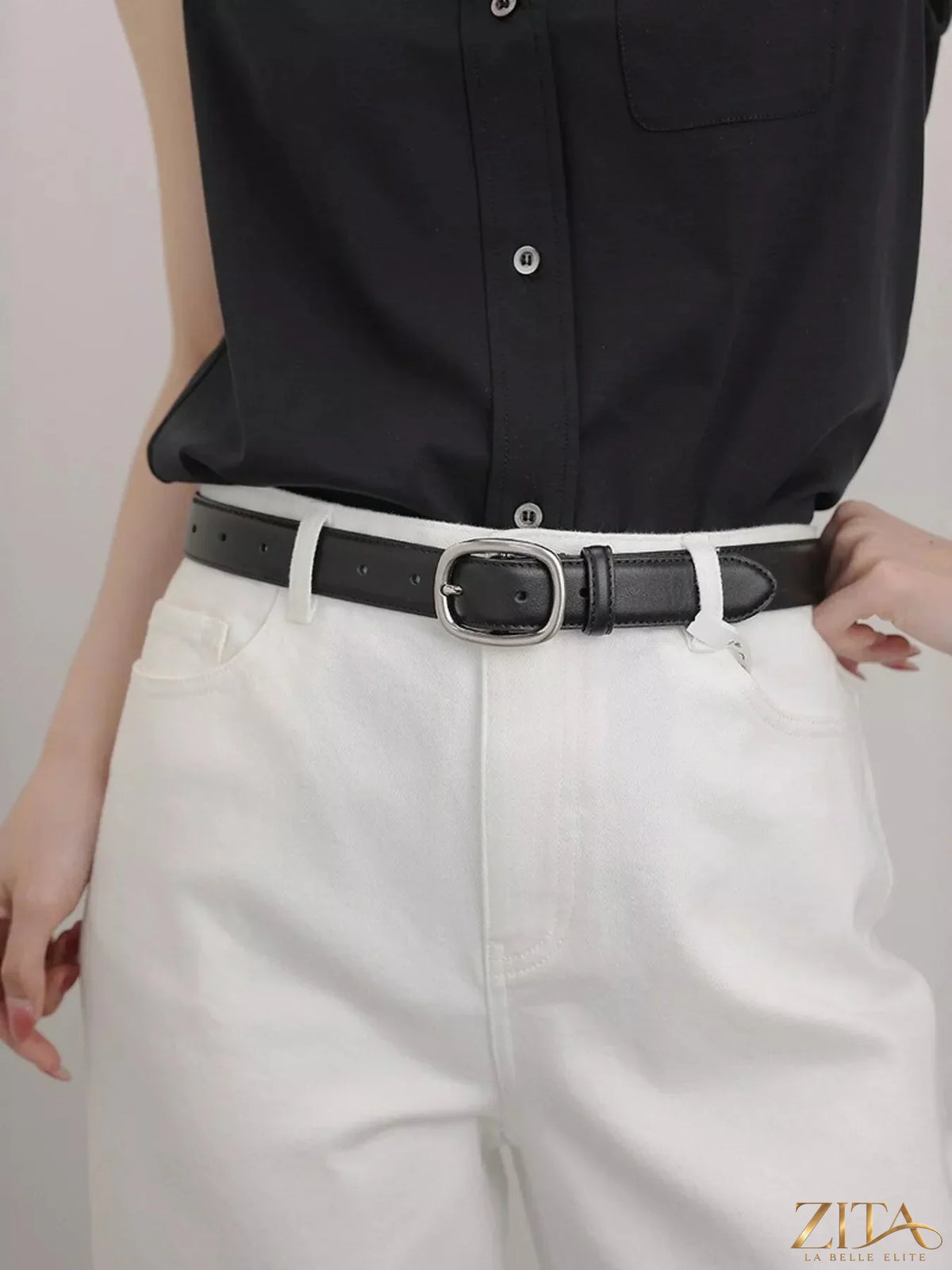 Leather belt with oval buckle by Trendsi, showcasing a smooth brown leather strap and stylish metal buckle.