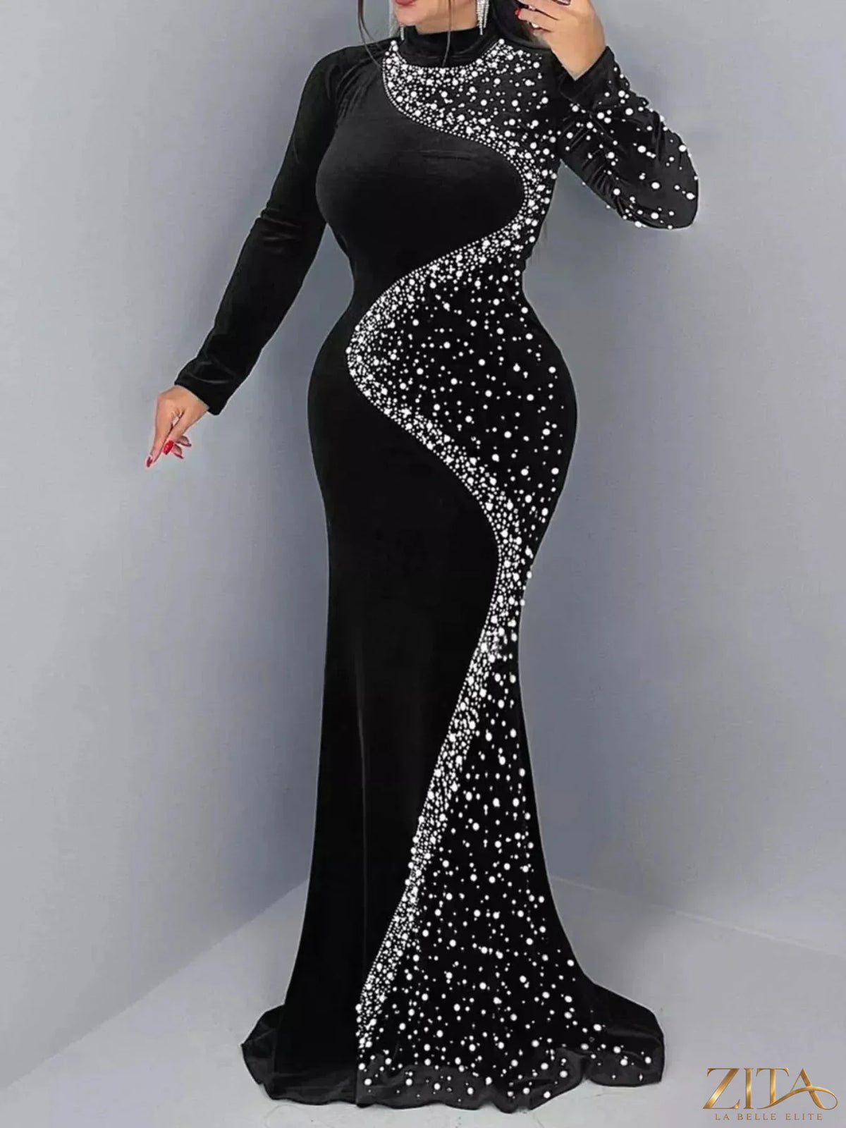 Elegant velvet mermaid evening maxi dress with rhinestone embellishments by Zita La Belle Elite, shown in a close-up view.