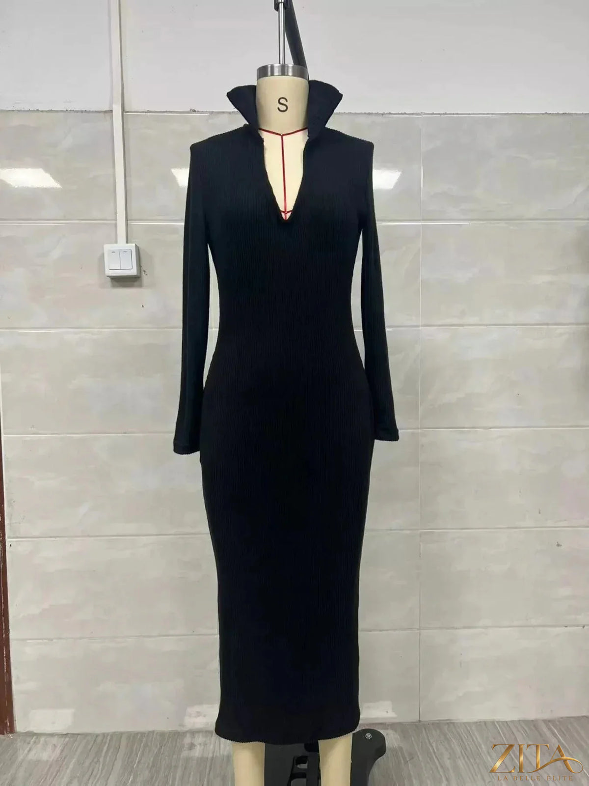 Zita La Belle Elite ribbed knit V-neck sweater dress, showing a close-up of the textured fabric and V-neck design.