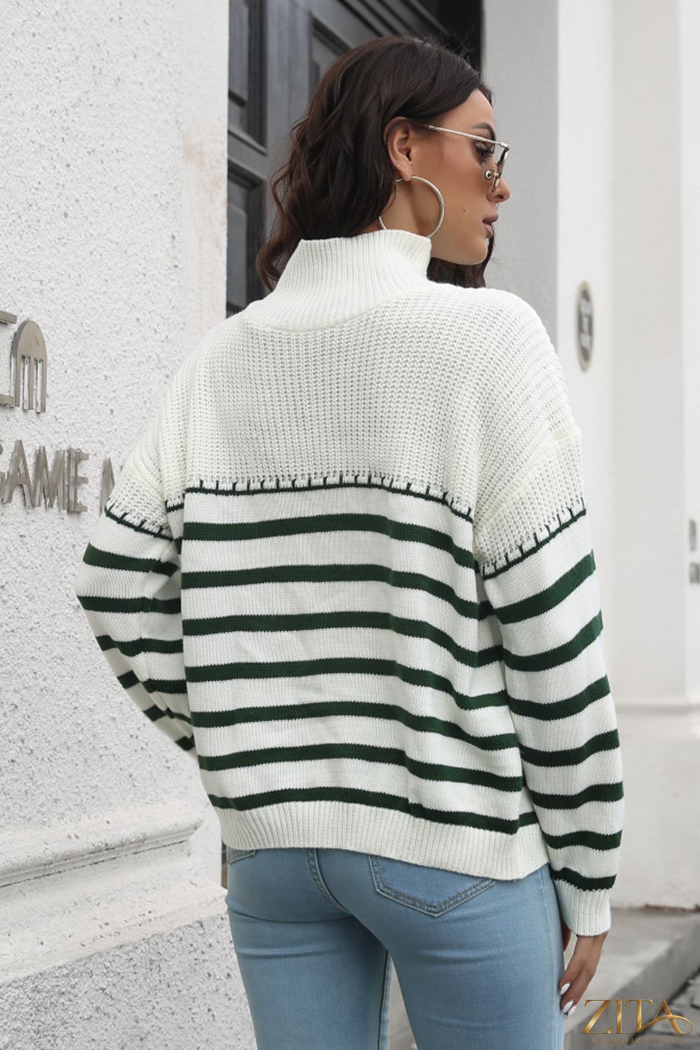 Striped turtleneck drop shoulder sweater by Trendsi, featuring a cozy knit design with horizontal stripes in various colors.