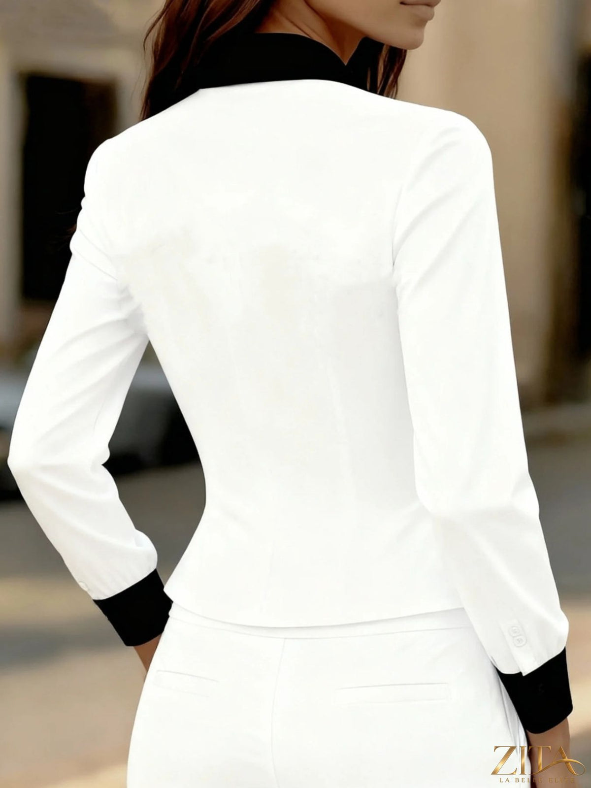 Zita La Belle Elite contrast button-down shirt with black and white color blocking, long sleeves, and classic collar.