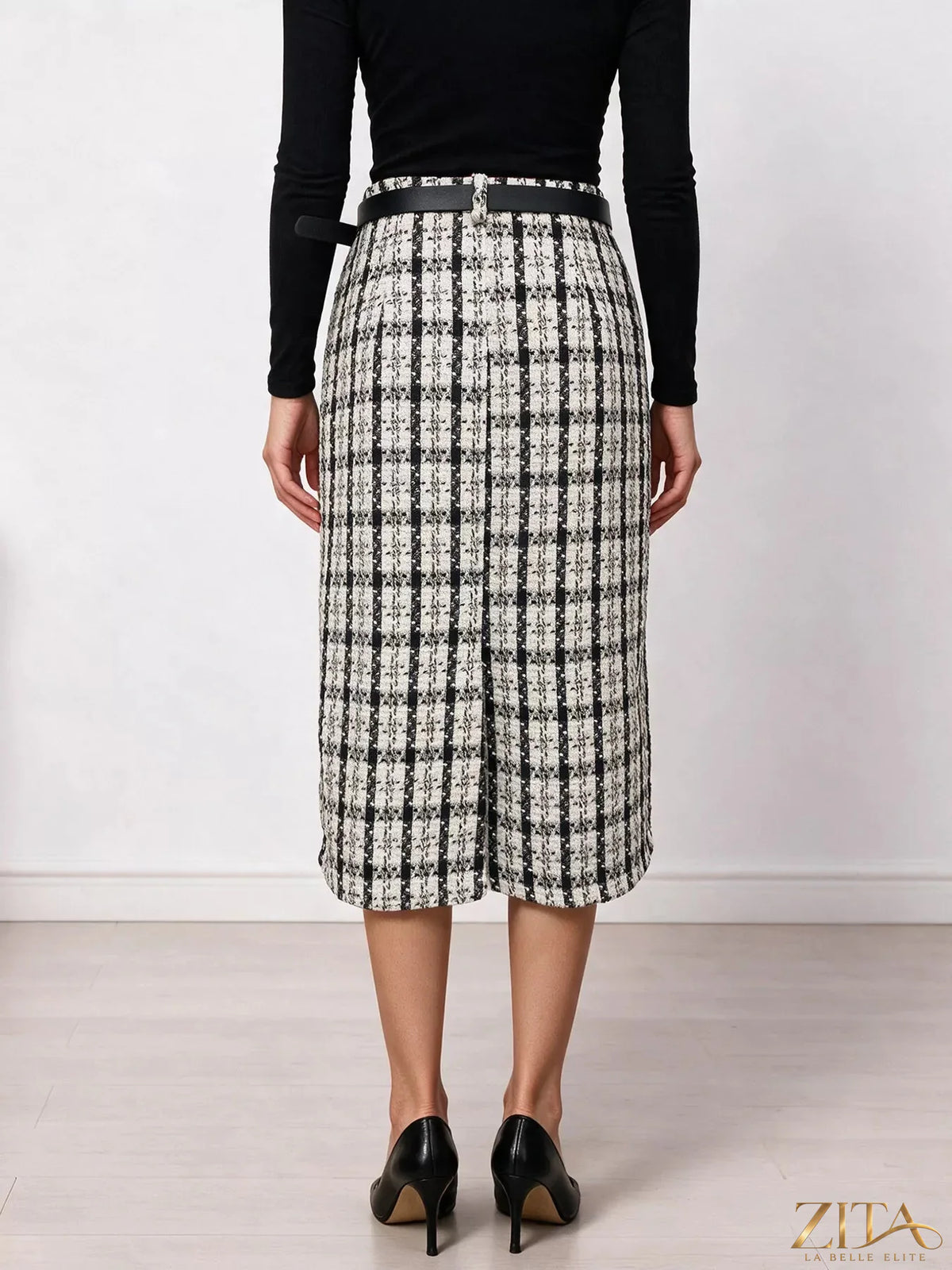 Zita La Belle Elite high-waisted tweed plaid midi skirt, stylish and tailored, shown in a close-up view highlighting the fabric and pattern.