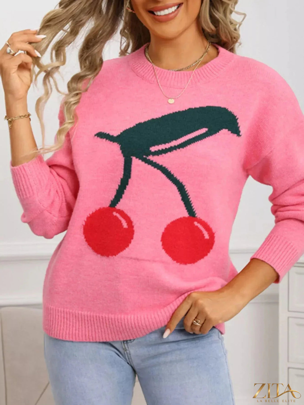Cherry-colored round neck sweater by Trendsi, featuring a cozy knit fabric and a classic fit, shown on a model.