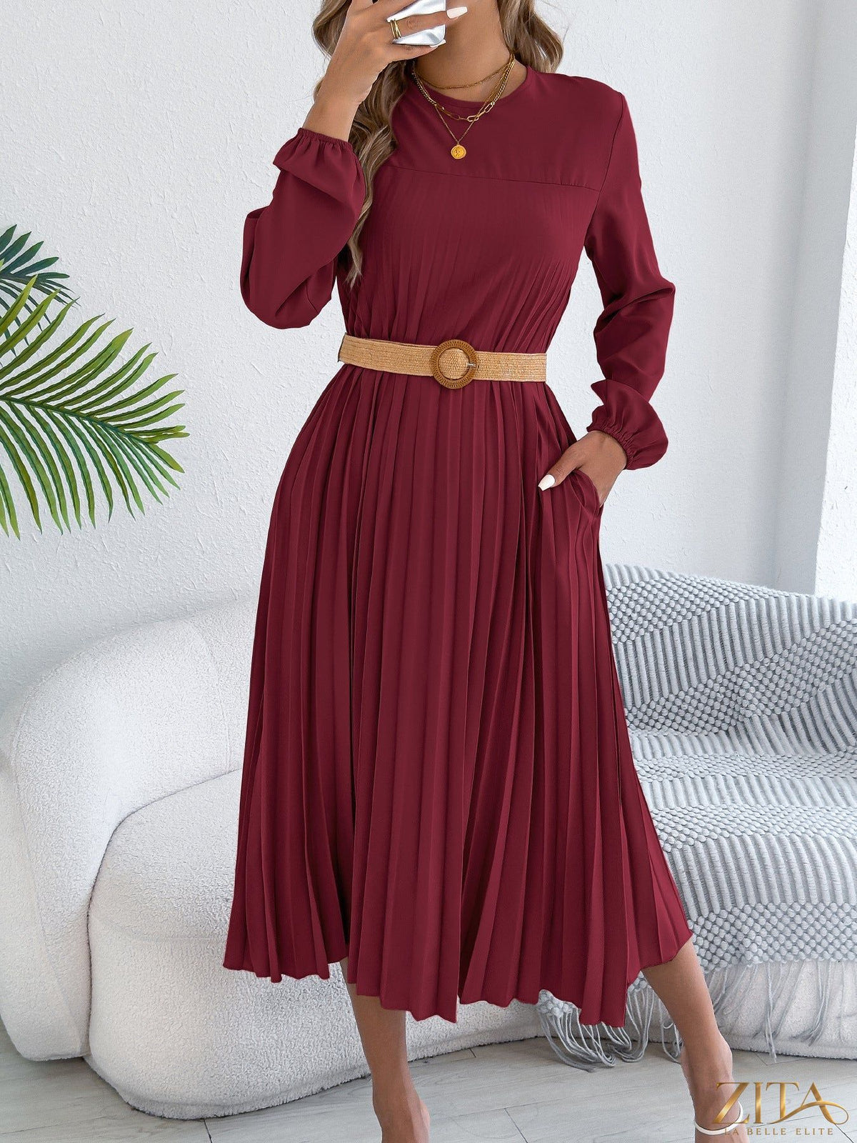 Zita La Belle Elite pleated A-line midi dress with a flowy silhouette and elegant design, shown on a dress form.