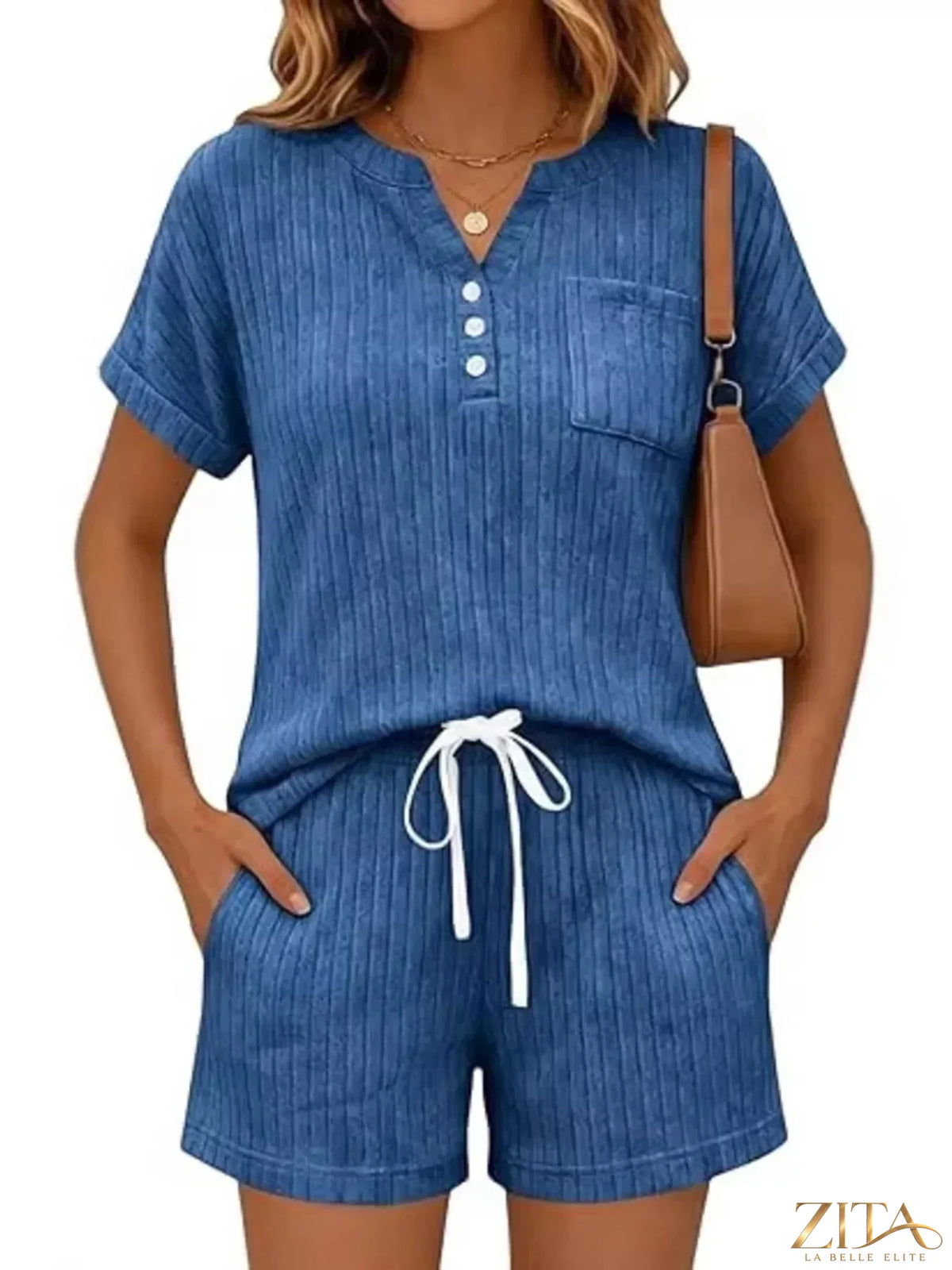 Casual ribbed knit tee and shorts set by Trendsi, featuring a comfortable, stylish matching top and bottoms in soft fabric.