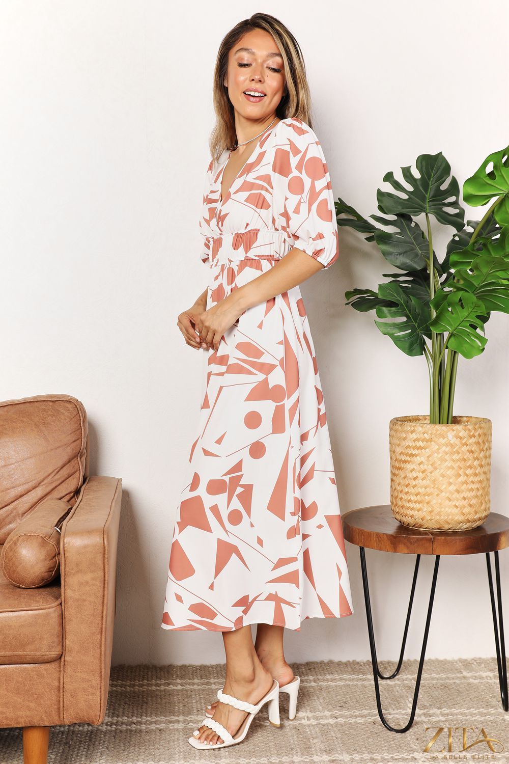 Zita La Belle Elite printed surplice balloon sleeve dress with a flowing silhouette and elegant pattern, perfect for stylish occasions.