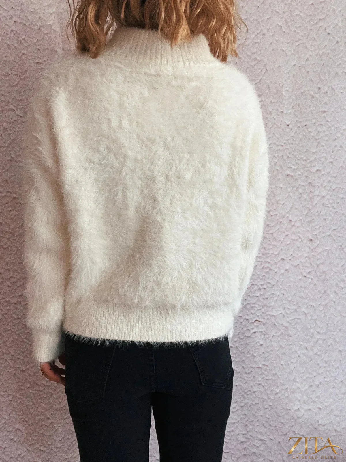 Zita La Belle Elite cozy fuzzy half-zip sweater in soft cream color, close-up of textured knit fabric and half-zip collar.