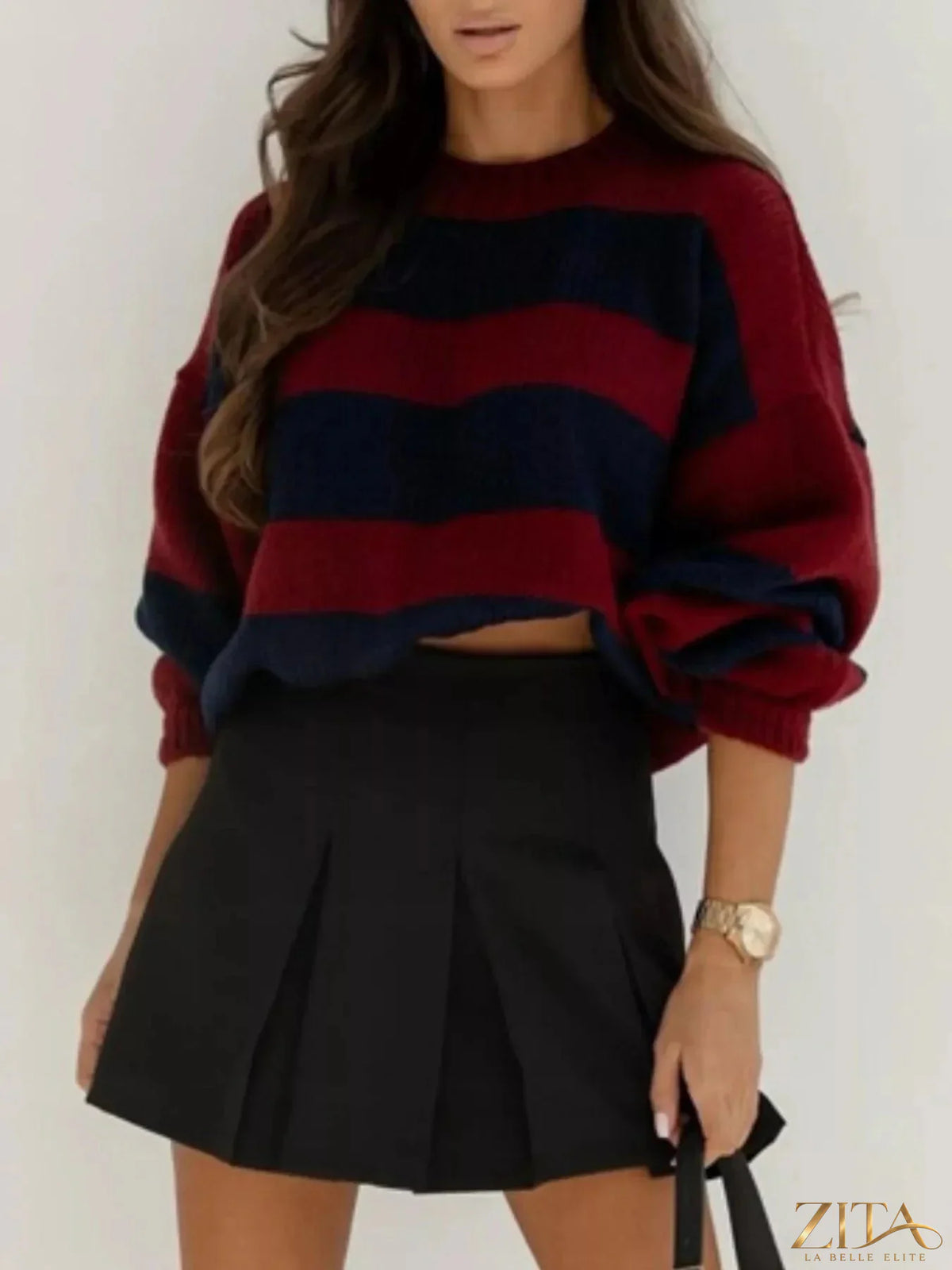Striped dropped shoulder sweater by Trendsi featuring a cozy knit design and relaxed fit, perfect for casual wear.