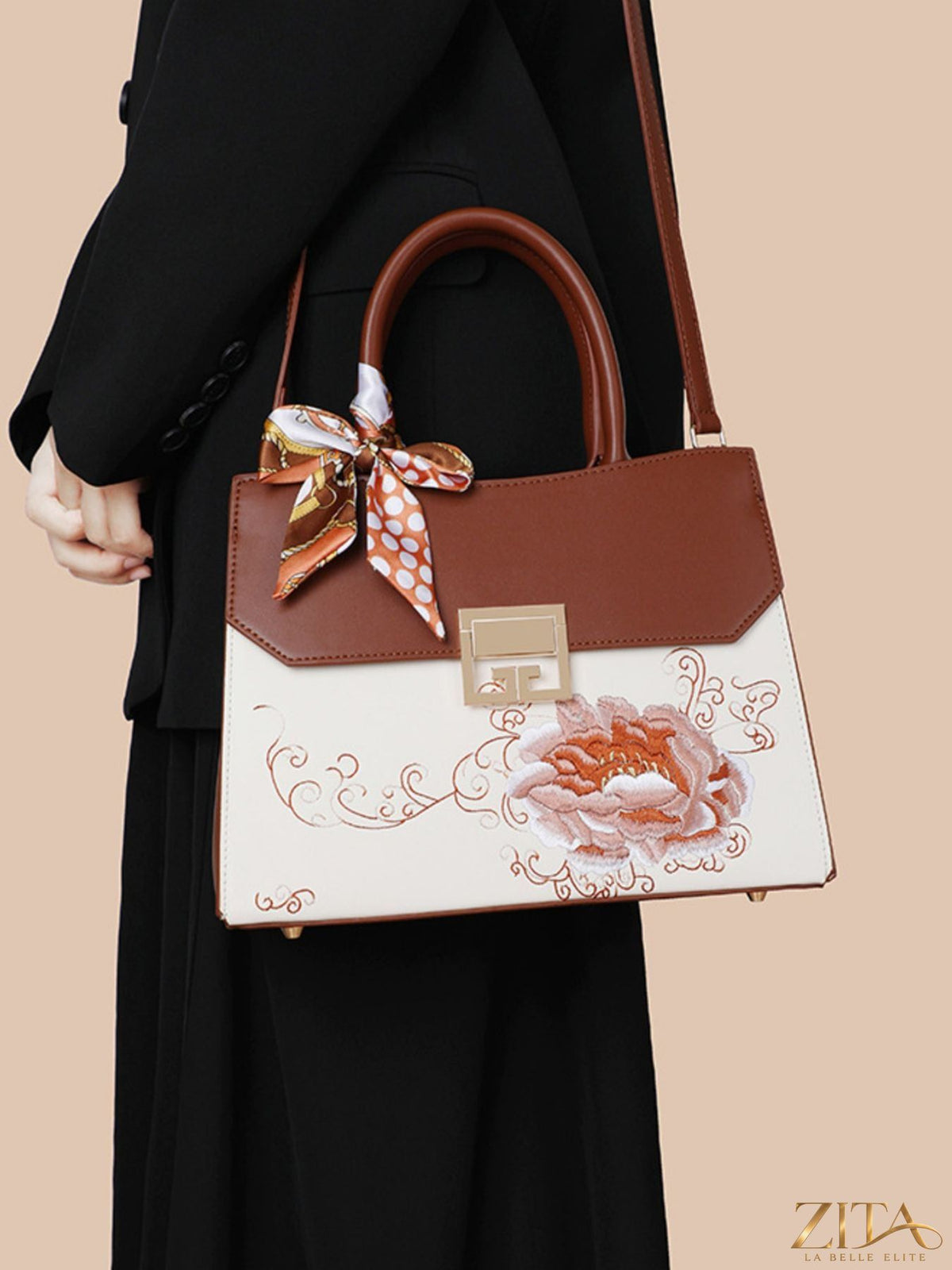 Zita La Belle Elite floral top handle handbag with colorful flower pattern and sturdy leather handles.