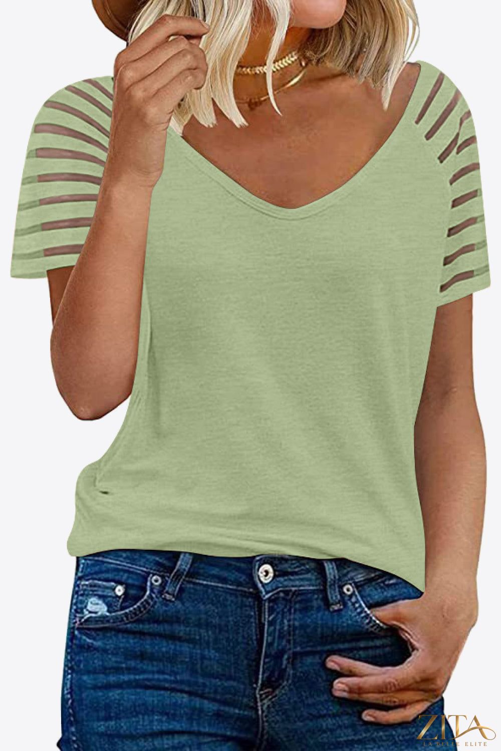 V-neck raglan sleeve t-shirt by Trendsi featuring contrasting color sleeves and a comfortable, casual fit.