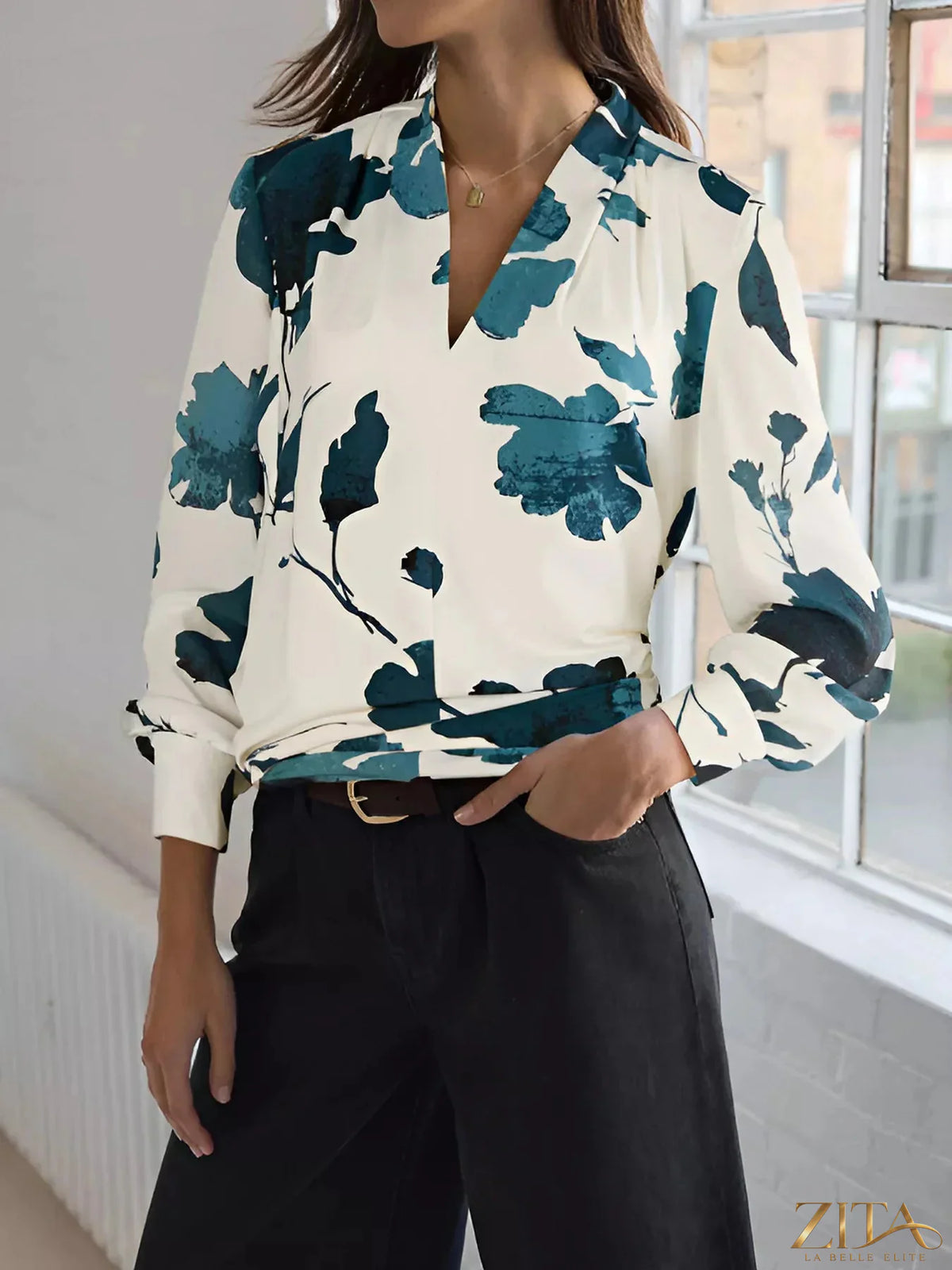Printed V-neck long sleeve blouse by Zita La Belle Elite, featuring a stylish floral pattern and lightweight fabric.