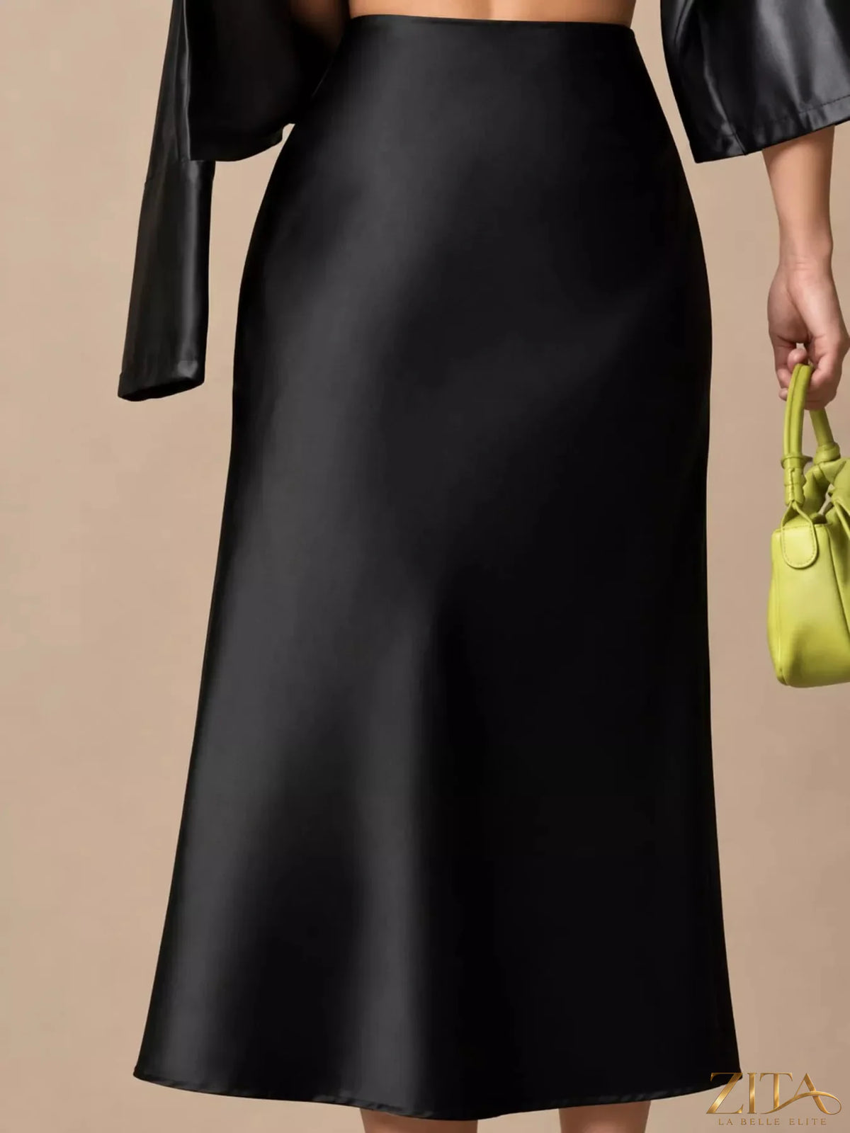 High-waisted satin midi skirt in a smooth, shiny fabric featuring a flowing silhouette and elegant design.