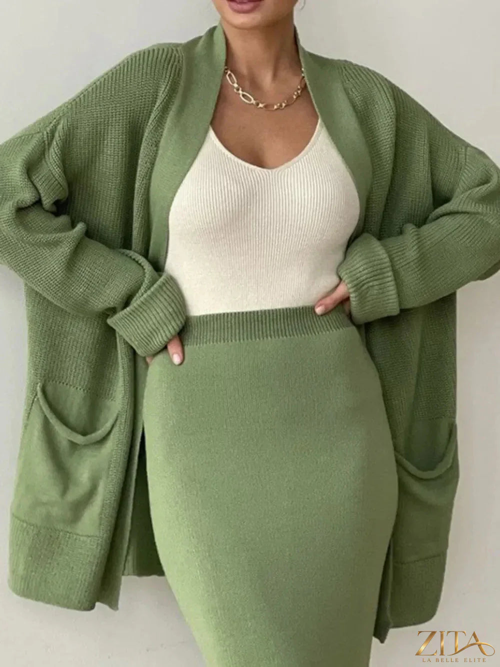 Zita La Belle Elite pocketed long sleeve cardigan and skirt sweater set, featuring a cozy knit fabric and stylish design.