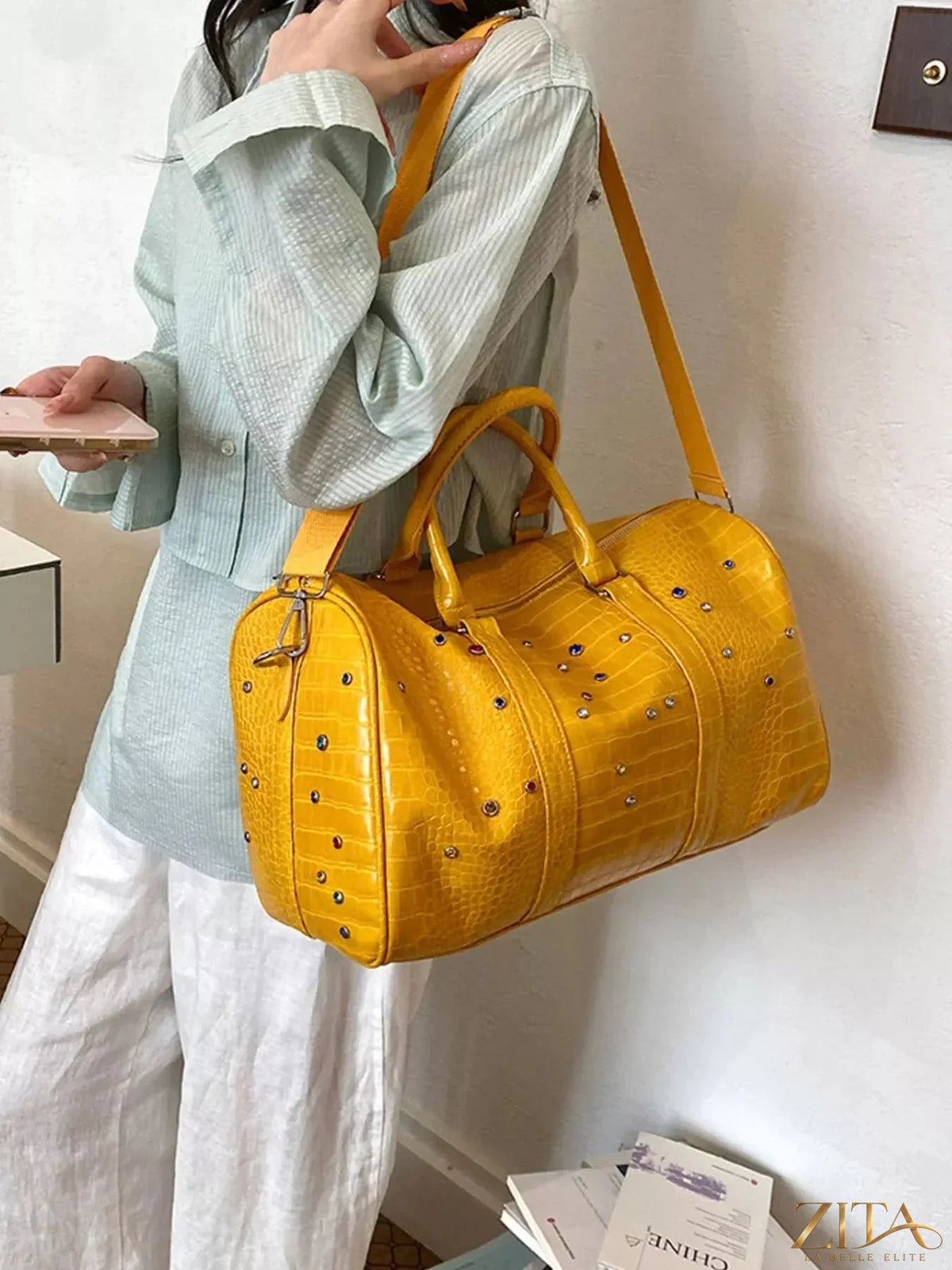 Crocodile embossed studded travel bag by Zita La Belle Elite featuring a sleek design and sturdy handles.