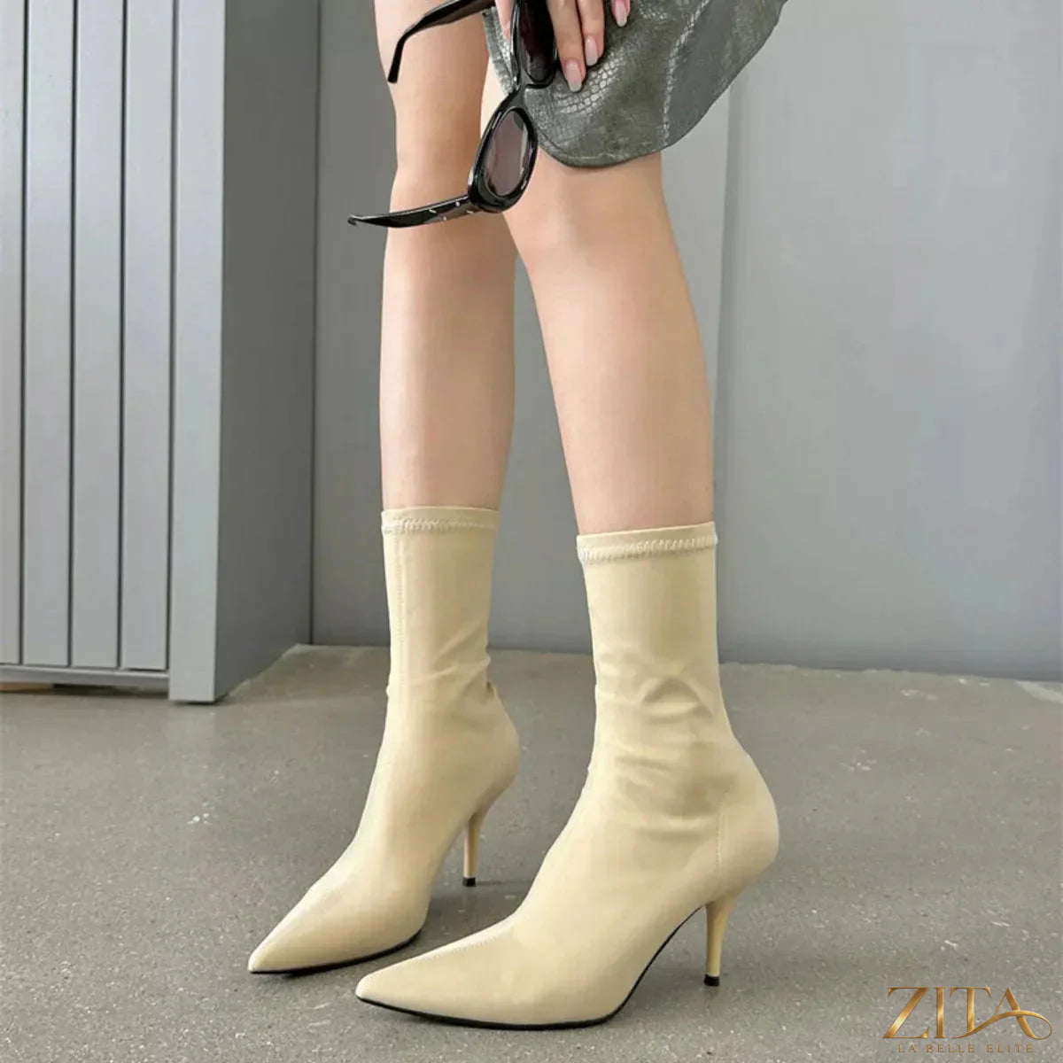Zita La Belle Elite point toe mid heel boots in black leather with sleek design and elegant silhouette.