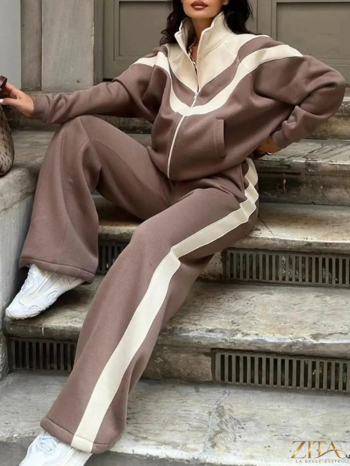 Color block zip-up outerwear and pants set by Zita La Belle Elite, featuring vibrant color blocks and a modern fit.