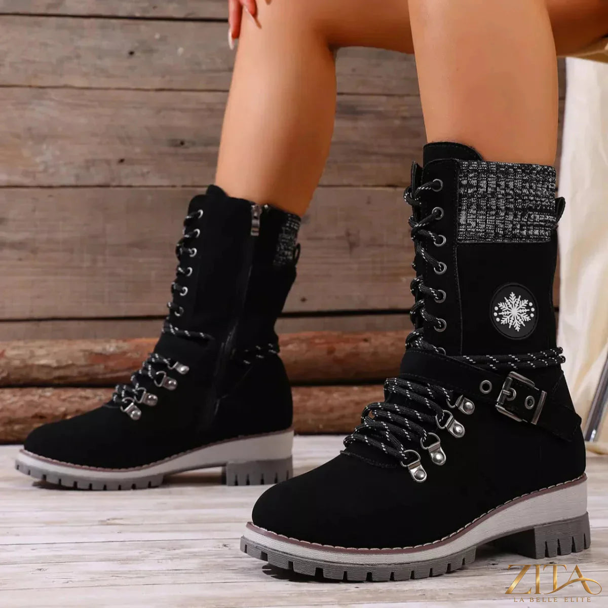 Black lace-up ankle combat boots by Trendsi featuring chunky soles and metal eyelets, perfect for edgy, casual outfits.