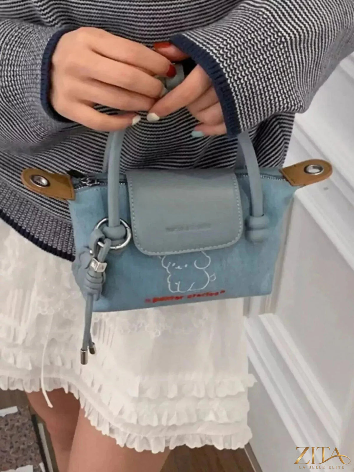 Denim handbag with puppy embroidery from Zita La Belle Elite, featuring a stylish design and detailed stitched puppy motif.