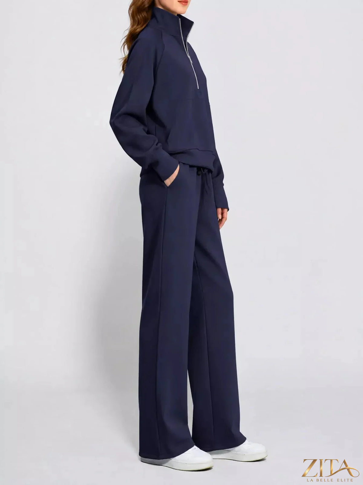 Zita La Belle Elite half-zip sweatshirt and wide-leg pants set, in soft fabric, displayed on a hanger with a neutral background.