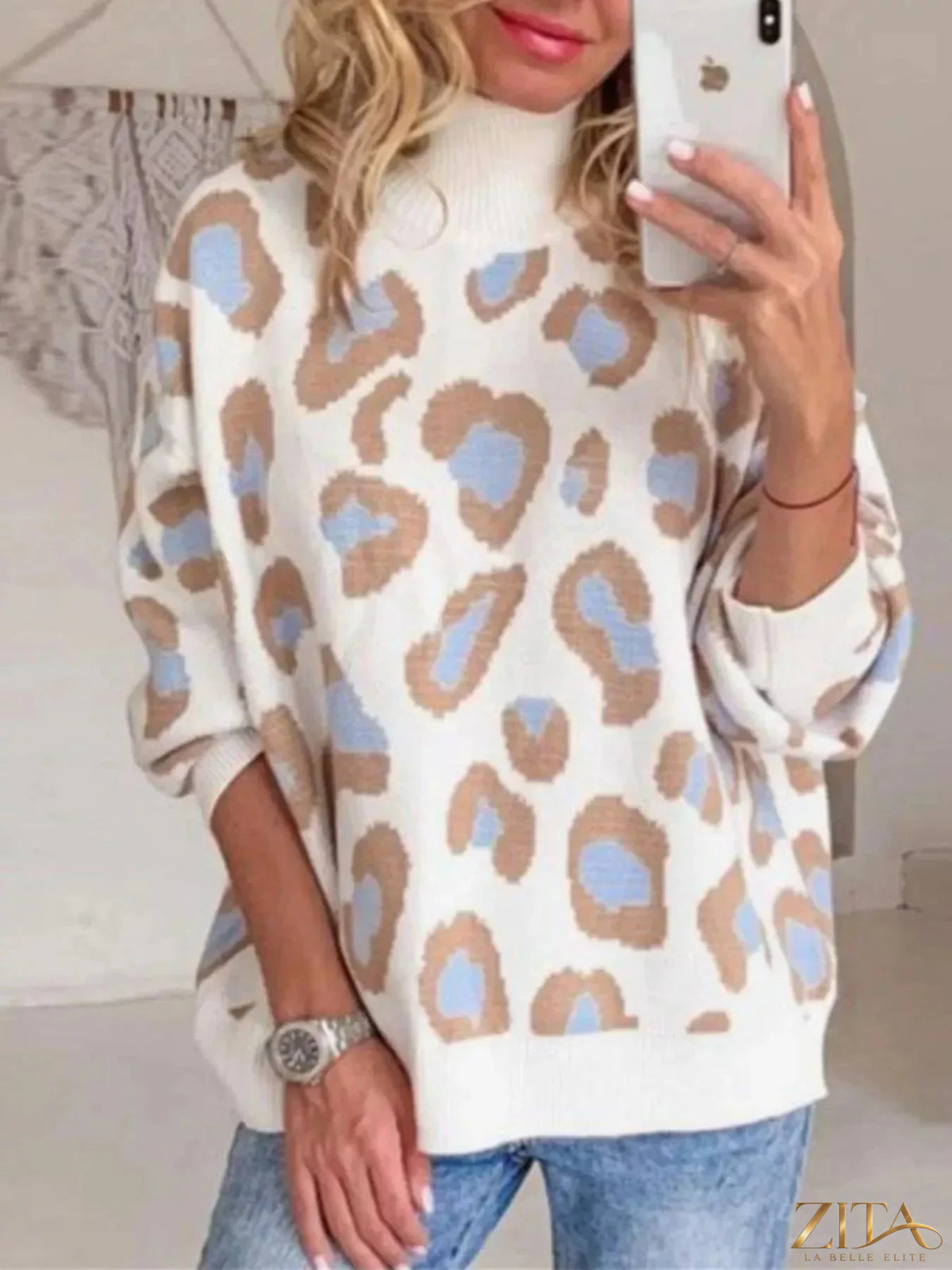 Zita La Belle Elite leopard print high neck sweater with long sleeves and ribbed cuffs, showcasing a stylish, cozy knit design.