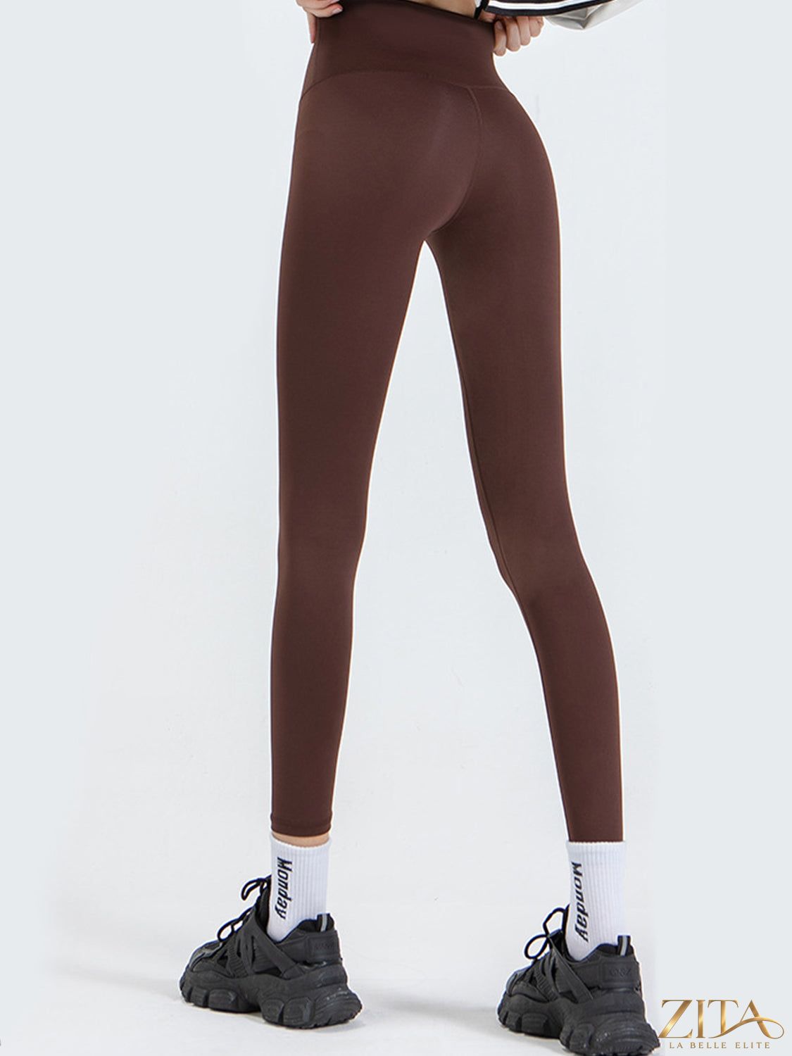 Zita La Belle Elite wide waistband sports leggings in black, showing a close-up of the high-rise, stretchy fabric and sleek fit.