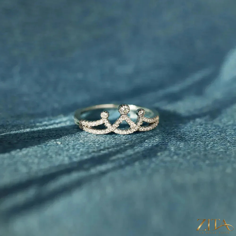 Sterling silver crown-shaped ring with inlaid zircon stones, designed by Zita La Belle Elite, showcasing intricate craftsmanship.