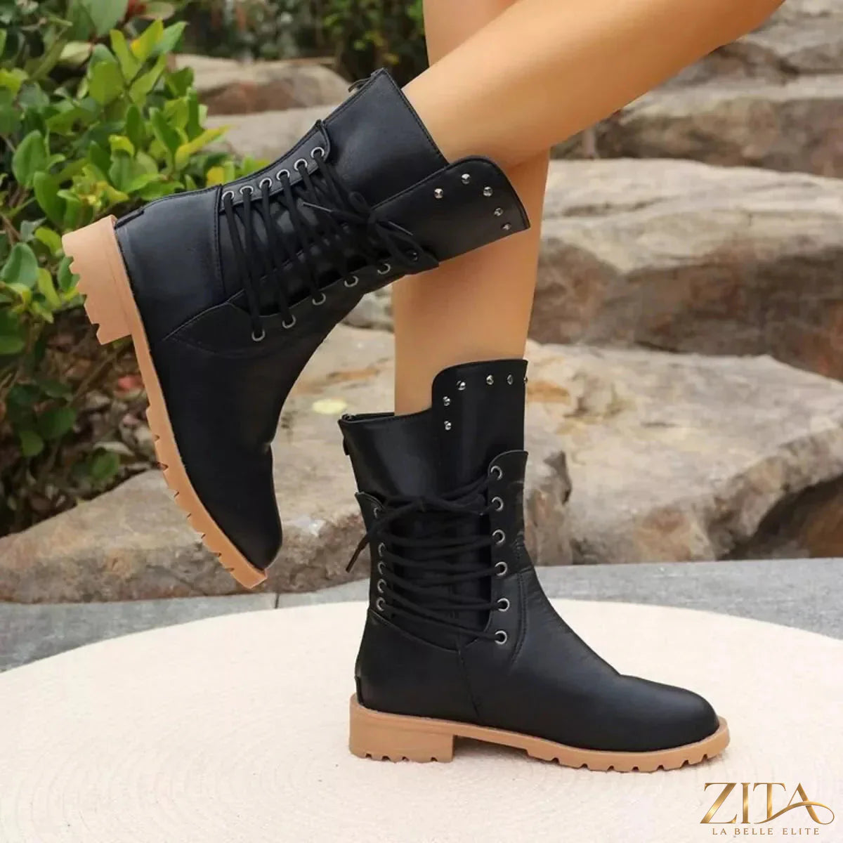 Black studded lace-up boots by Trendsi featuring chunky heels and metallic embellishments, stylish for casual or edgy looks.
