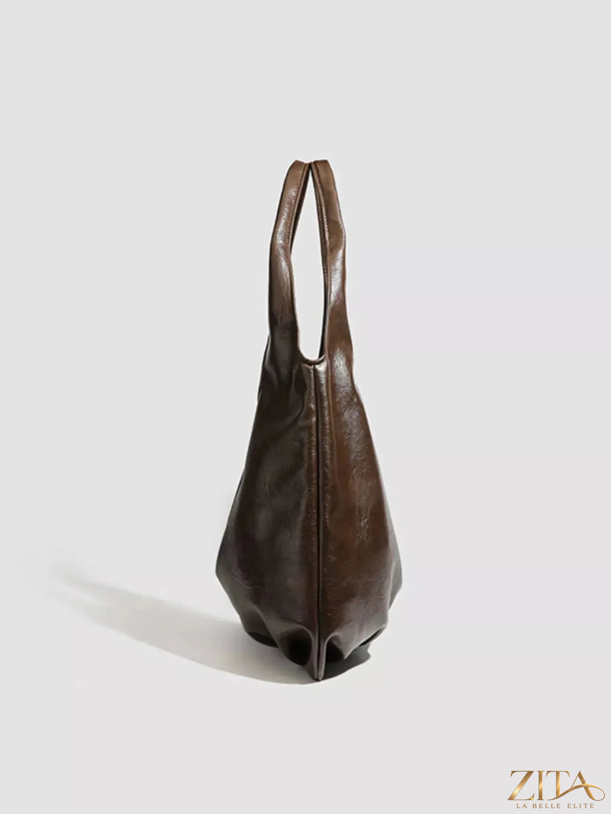 Vintage glossy hobo shoulder bag with matching pouch by Zita La Belle Elite, featuring a sleek design and stylish leather finish.