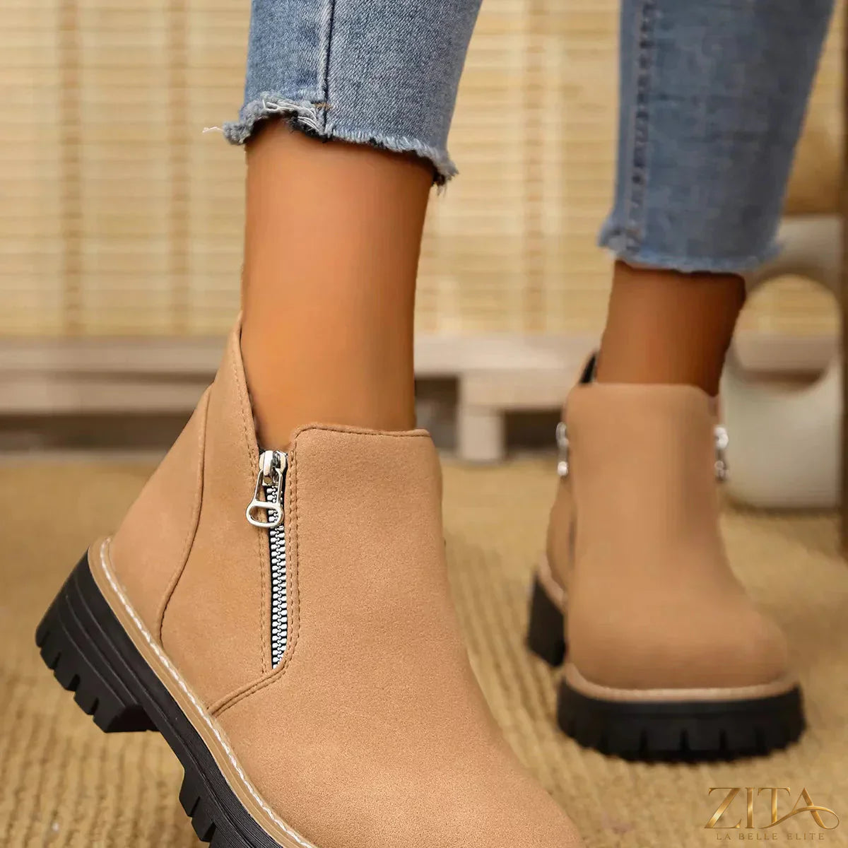 Zita La Belle Elite ankle boots with zipper accent, showcasing stylish black leather with sleek zipper details on the side.