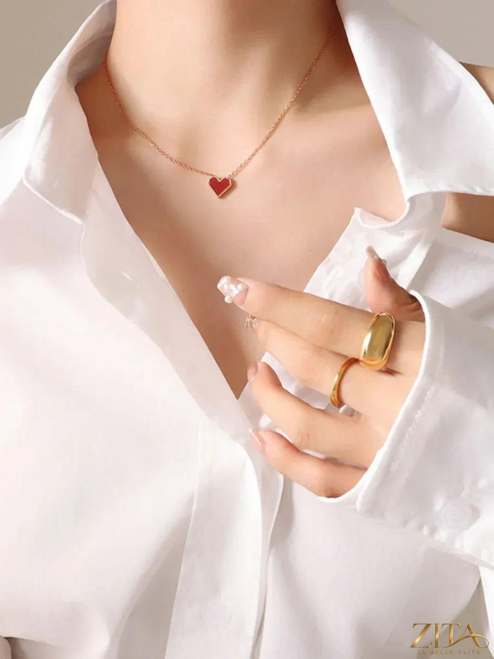 Titanium steel heart necklace by Zita La Belle Elite featuring a sleek, polished heart pendant on a delicate chain.