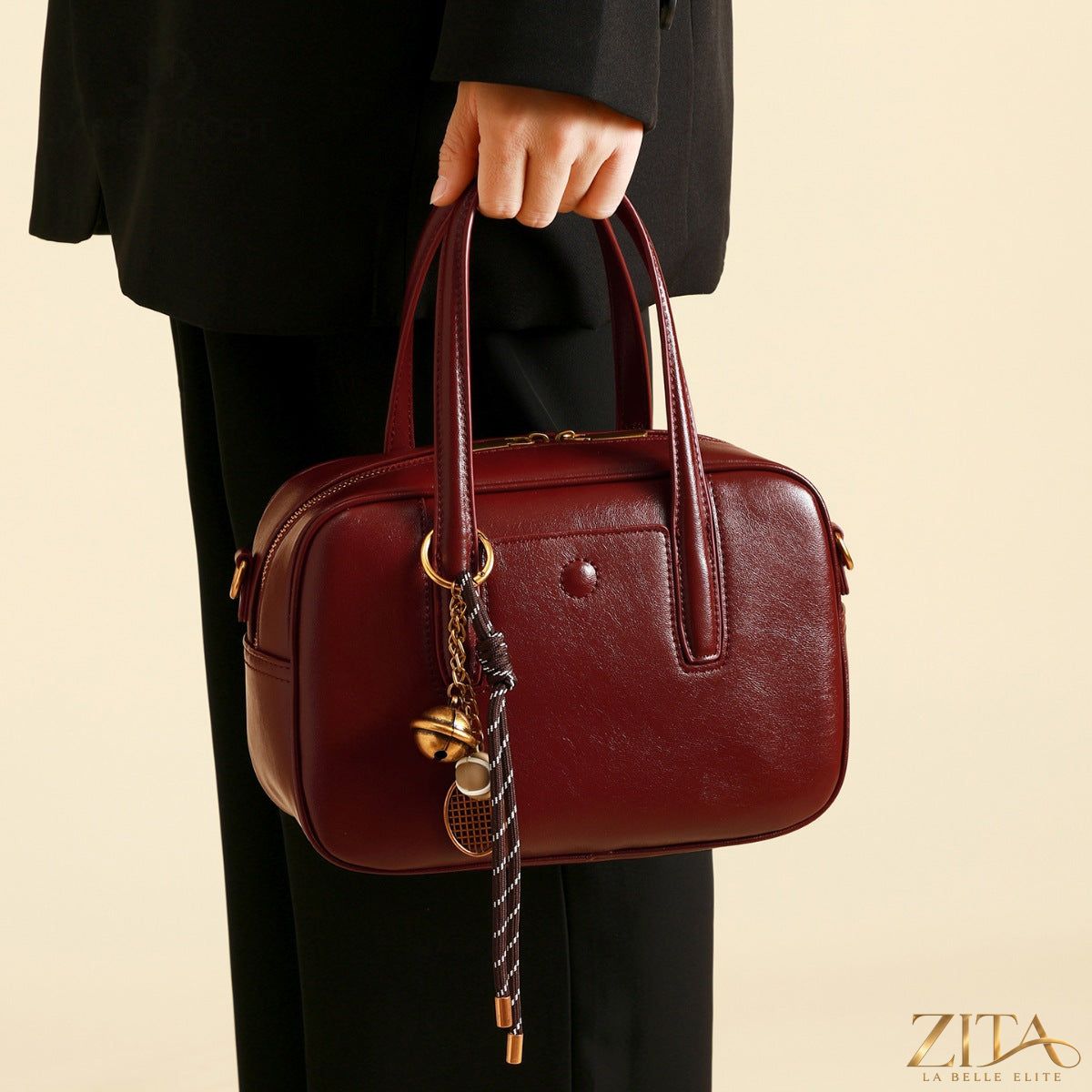Zita La Belle Elite leather top handle handbag with structured design and gold-tone hardware, showcasing elegant craftsmanship.
