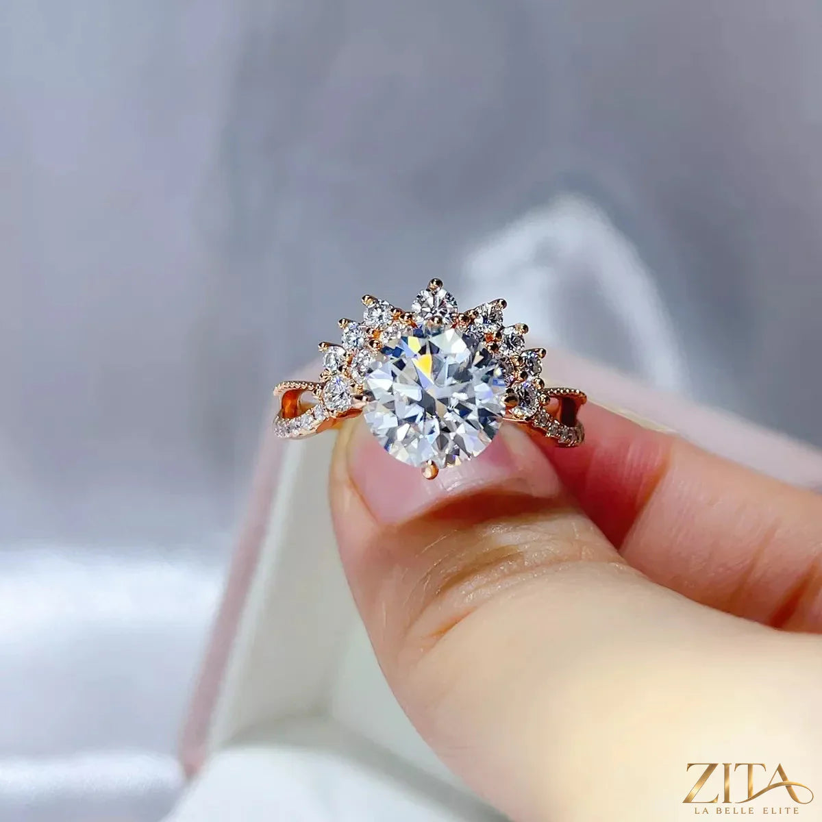 Three-carat sterling silver Moissanite ring by Zita La Belle Elite, featuring a sparkling center stone and intricate band details.