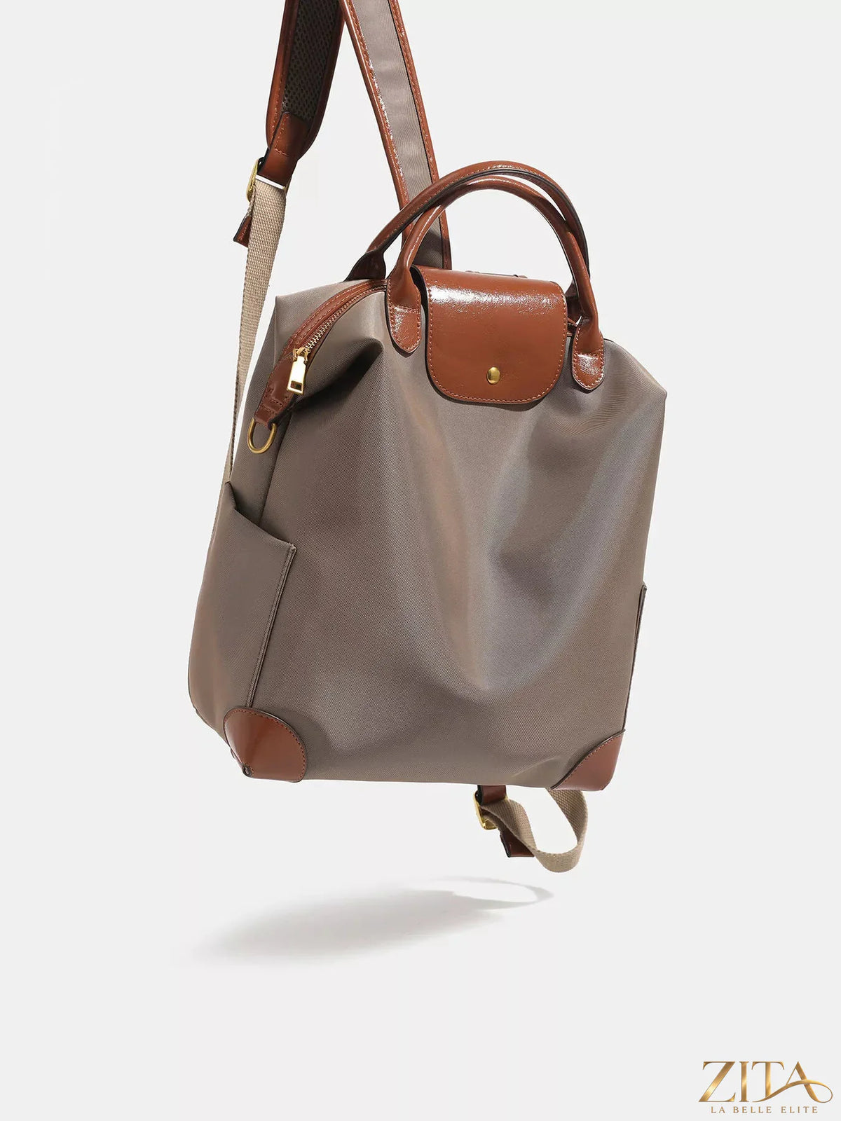 Leather trim backpack bag with adjustable straps and multiple compartments, featuring stylish design and durable construction.